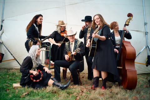 The Dutton family with instruments on stage